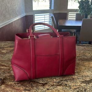Ann Taylor pink leather bag. Hardly carried.Great shape. A roomy bag for travel.